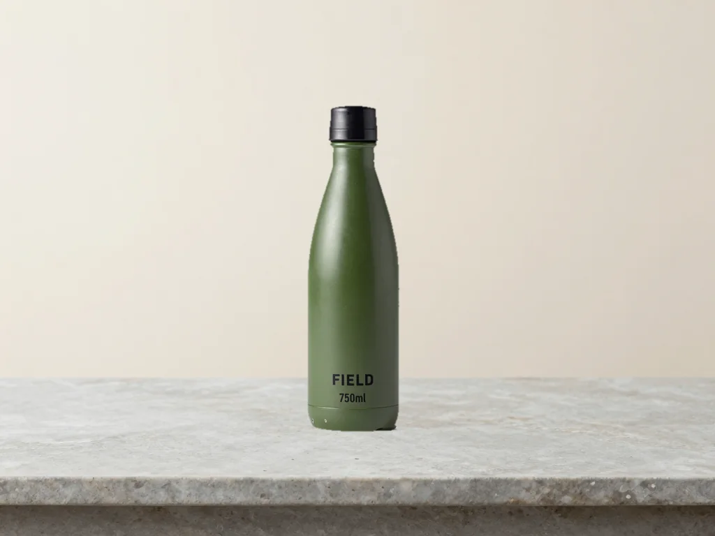 The same fictional FIELD bottle with its refined cutout mask on the generated light studio background.